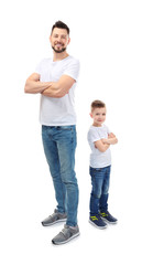 Handsome man with his son on white background