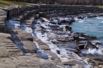 Fototapeta premium Ice covered, frigid Lake Michigan shoreline in Chicago south side park.