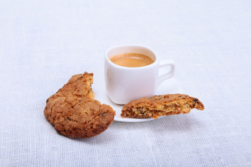 Fresh homemade muffin, cake and white cup of Cappuccino on white background.