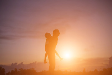 silhouette of a happy children and happy time sunset 