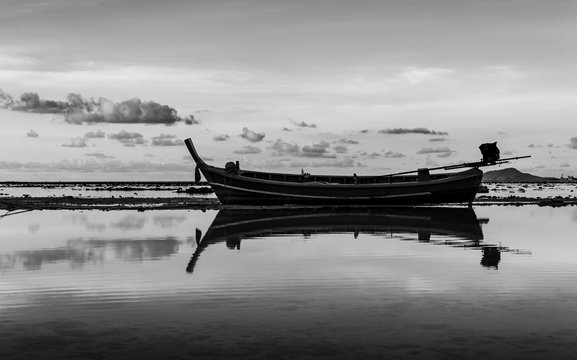 Fototapeta Seascape with boat in twilight black and white