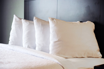close up on pillows on the bed in hotel