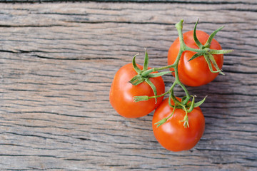 Hipster tone Top view group of tomato on old wood background, selective and soft focus