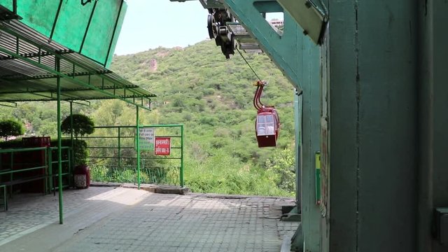 A ropeway trolley is carrying the devotees of Goddess Mansapurna Karni Mata in Udaipur from one end to another.