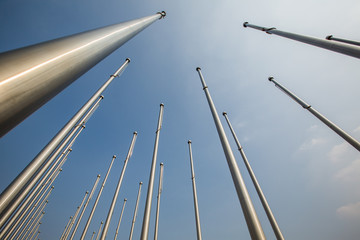 Fototapeta premium Row of flagpole in empty square,Tianjin,China.