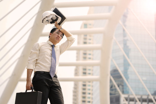 Tired or stressful businessman stop walking in city after working