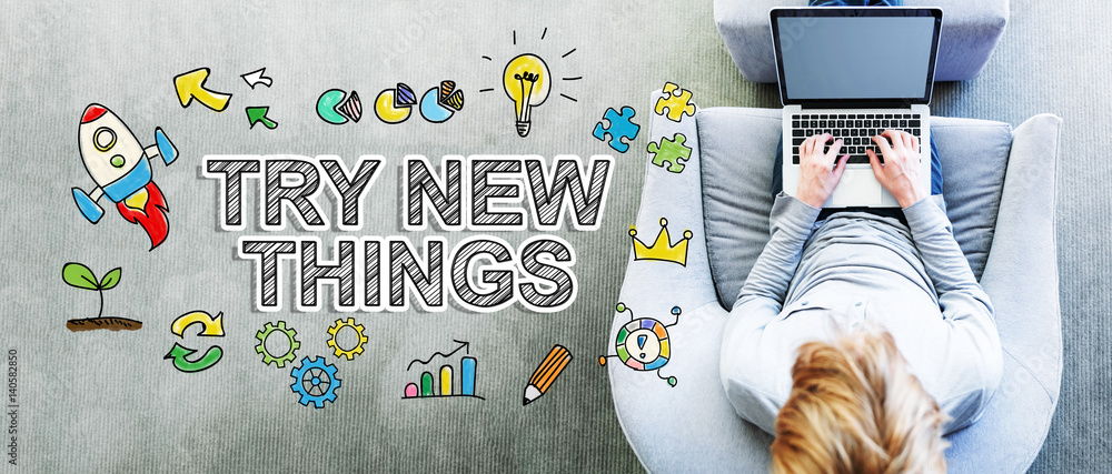 Poster try new things text with man using a laptop