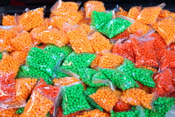 Many small round plastic containers, clear plastic bag.