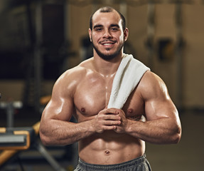 Fototapeta premium smilimg athlete with towel