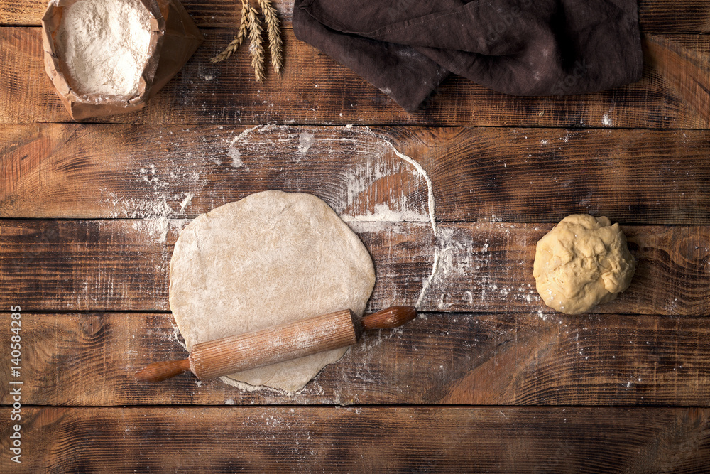 Poster roll out dough with rolling pin and flour