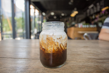 Water spray on a cup of cold coffee