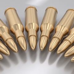 Curved Line of Gold Bullets on White