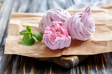 Homemade berry marshmallows and green mint.