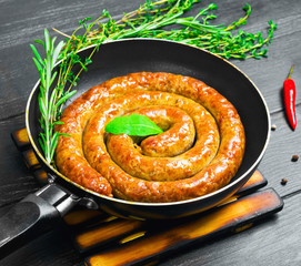 Grilled sausage snail coil spiral, barbecue.