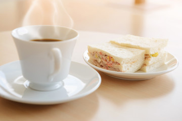 Obraz na płótnie Canvas Tuna sandwich with hot tea