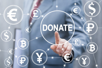 Donation money finance concept. Business man touched Donate word icon on virtual screen. Donating trading exchange and stock market, giving financial facilities.