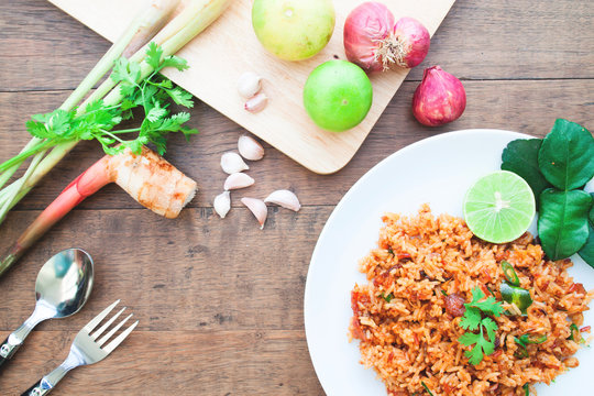 Thai food spicy fried rice with ingredients on wood table, Overhead view shot