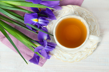 narcissus and a cup with tea