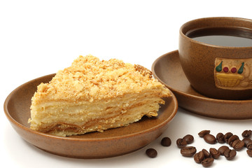 cake napoleon on plate with coffee isolated on white background