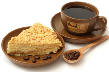cake napoleon on plate with coffee isolated on white background