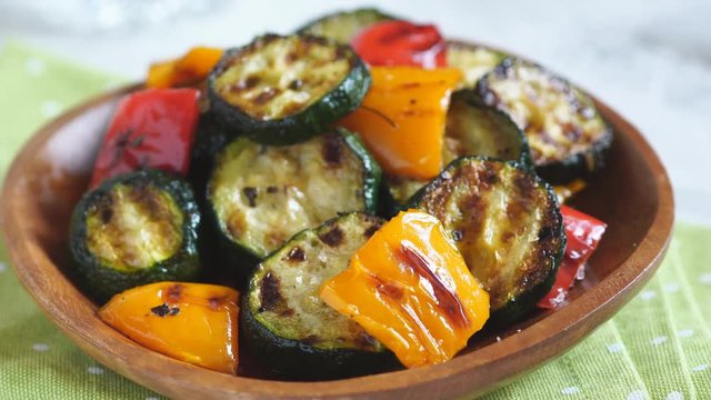Grilled vegetables salad with zucchini, eggplant, onions, peppers and herbs