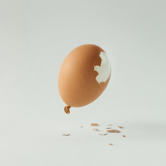 Egg balloon on bright white background. Minimal creative concept. Flat lay.