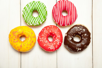 Doughnuts on a white wooden table