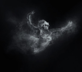 Dancer from smoke on the dark background
