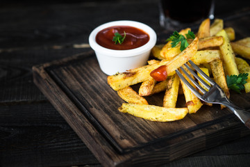 Fried potato with ketchup sauce and cola. Fast food menu.