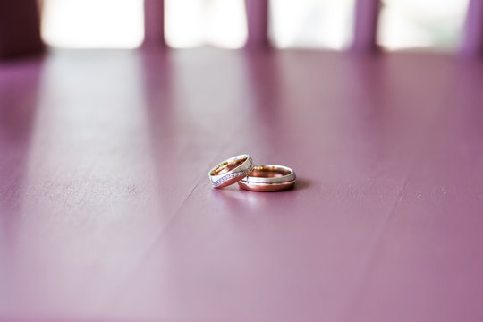 Beautiful Wedding Rings Lying On Table