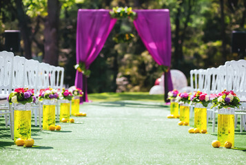 Beautiful wedding archway with chairs on on each side