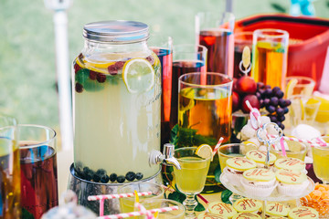 Delicious lemonade and sweeties, staying on dessert table