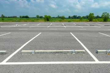 Fototapeta premium Empty parking lot on blue sky background