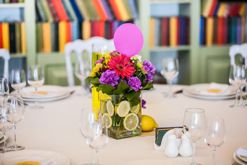 Guest table decorated with gaudy bouquet