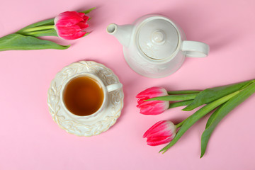 tulips,  teapot and a cup with tea