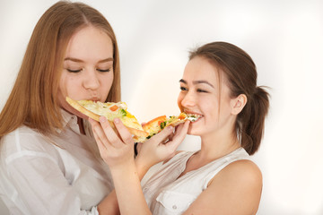 happy girls eats pizza on white background