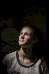 Fototapeta premium Portrait of a young girl with long hair in summer clothes