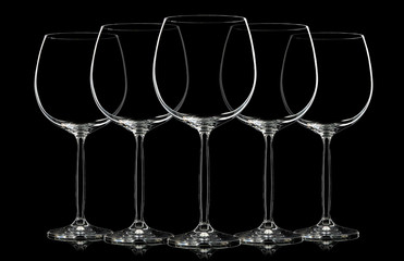 Silhouette of wine glass on black background.