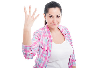 Attractive woman doing number four gesture