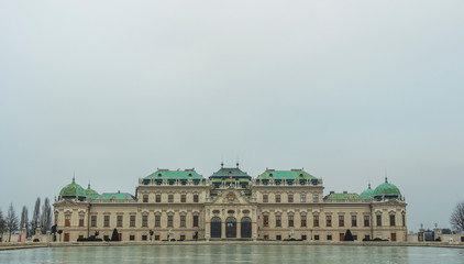 Fototapeta na wymiar Belvedere Palace in Vienna on a gloomy winter day with frozen fountain