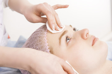 Cleaning face in beauty salon
