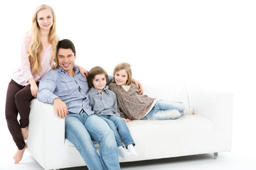 Family sitting together on the couch isolated.