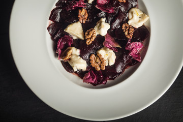 Beetroot salad with goat cheese and walnuts. Vegetarian food. Restaurant