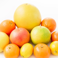 Fruits pattern made of lemon, orange, grapefruit, sweetie and pomelo on white background.