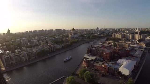 Aerial of moscow river navigation. Boat. Cathedral of Christ the Saviour. Moscow Kremlin. Golden dome churches, Moscow river. Car traffic at the walls of the Kremlin. Autumn panorama of Moscow city ce
