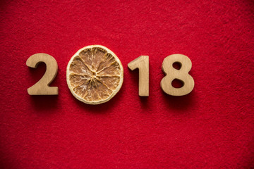 happy new Year 2018 - wooden digits lie on wooden plank background. photo image. empty copy space...