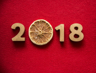 happy new Year 2018 - wooden digits lie on wooden plank background. photo image. empty copy space...
