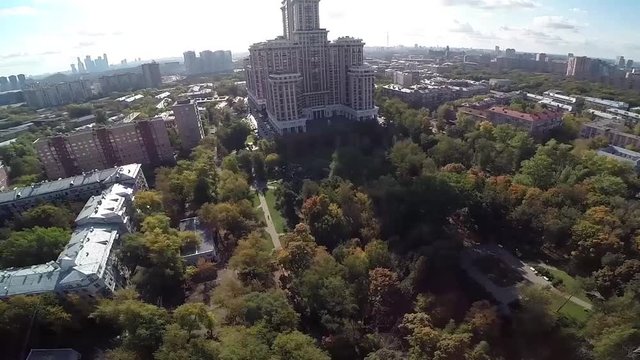 Aerial view of highest Moscow Building Triumph-Palace. Exterior of skyscraper Triumph-Palace against megalopolis at sunny day. House is tallest living building in Europe with high 264,5 meters.