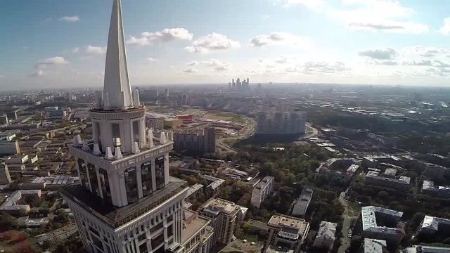Aerial view of highest Moscow Building Triumph-Palace. Exterior of skyscraper Triumph-Palace against megalopolis at sunny day. House is tallest living building in Europe with high 264,5 meters.