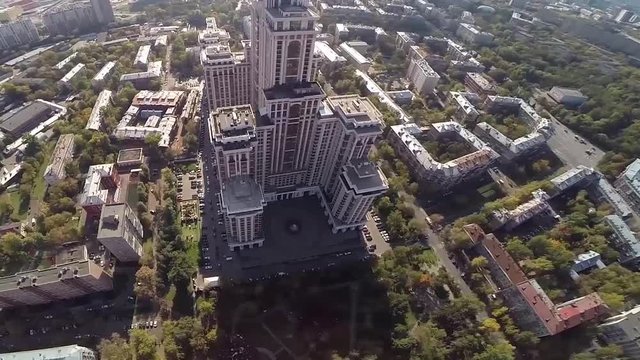 Aerial view of highest Moscow Building Triumph-Palace. Exterior of skyscraper Triumph-Palace against megalopolis at sunny day. House is tallest living building in Europe with high 264,5 meters.